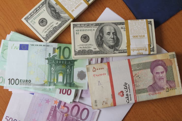 Premium: Dollar and Iranian rial with greek euro notes