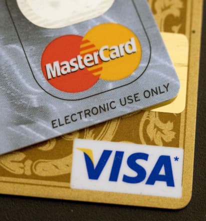 Visa, Mastercard pause work on new payments code for firearms sellers