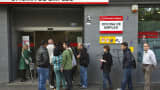 Jobseekers are seen entering an employment office after the opening in Madrid, Spain.