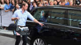 Prince William, Duke of Cambridge, leaves the Lindo Wing of St. Mary's Hospital in London with his newborn son.