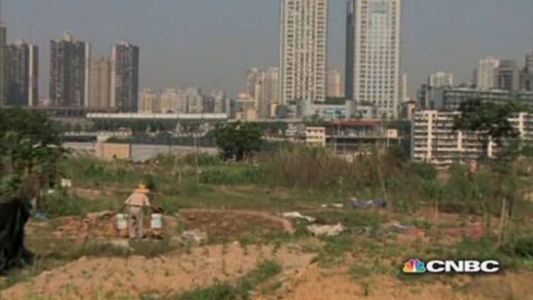 China's farmers trade acres for apartments