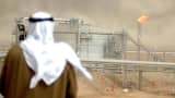 An employee of the Kuwait Oil Company (KOC) looks at the Gathering Center No.15 of al-Rawdatain field, 100 kms north of Kuwait City.