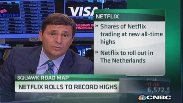 Netflix rolls to record highs