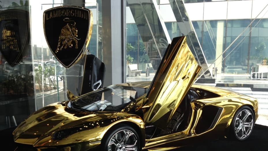gold car aventador
