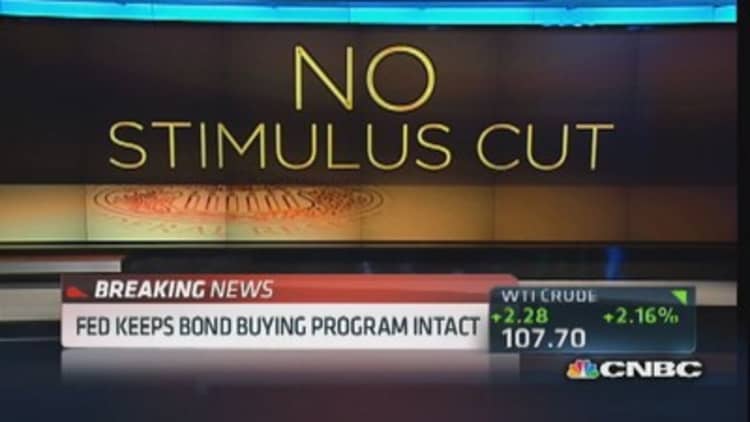Fed keeps bond-buying program intact