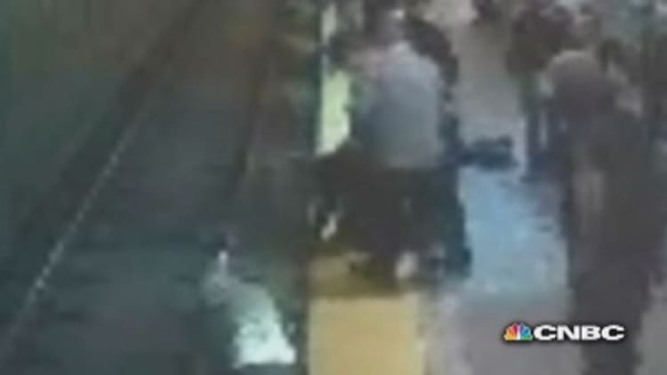 Boston woman falls onto train tracks, is rescued