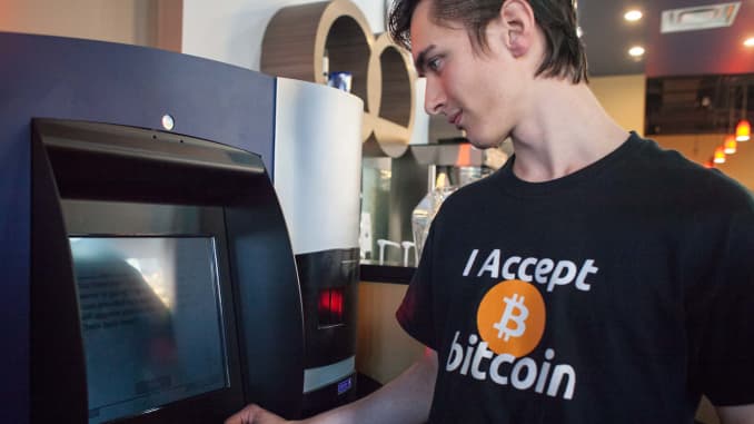 Gabriel Scheare uses the world's first bitcoin ATM on October 29, 2013, at Waves Coffee House in Vancouver, British Columbia. Scheare said he "just felt like being part of history."
