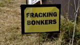 Fracking Bonkers reads a protest sign at the roadside near to a drilling test site in the UK, 2013