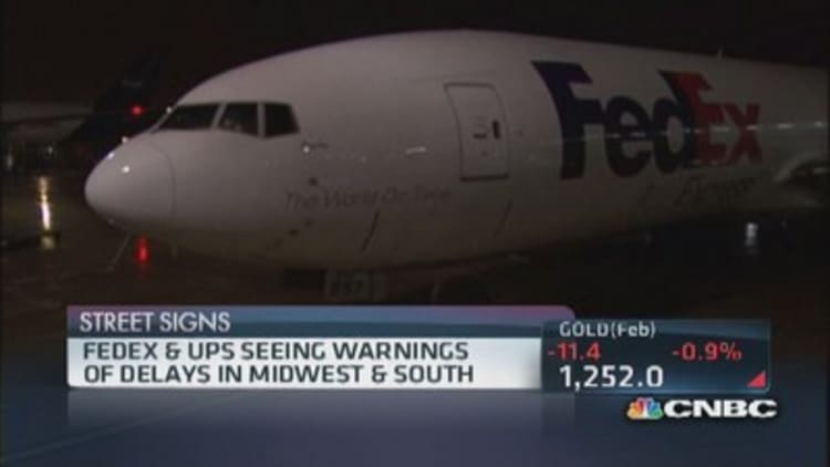 FedEx & UPS warn of delays