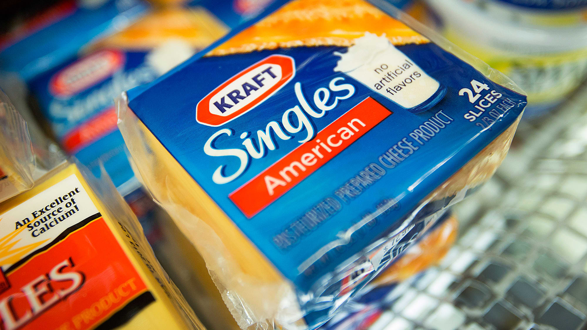 Packages of Kraft Foods' Singles cheese slices are displayed at a supermarket in New York.