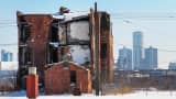 A decaying building and downtown skyline of Detroit, February 2014.