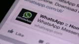 An advertisement for the WhatsApp Inc. mobile-messaging application is seen on a Facebook Inc. application feed displayed on an Apple Inc.