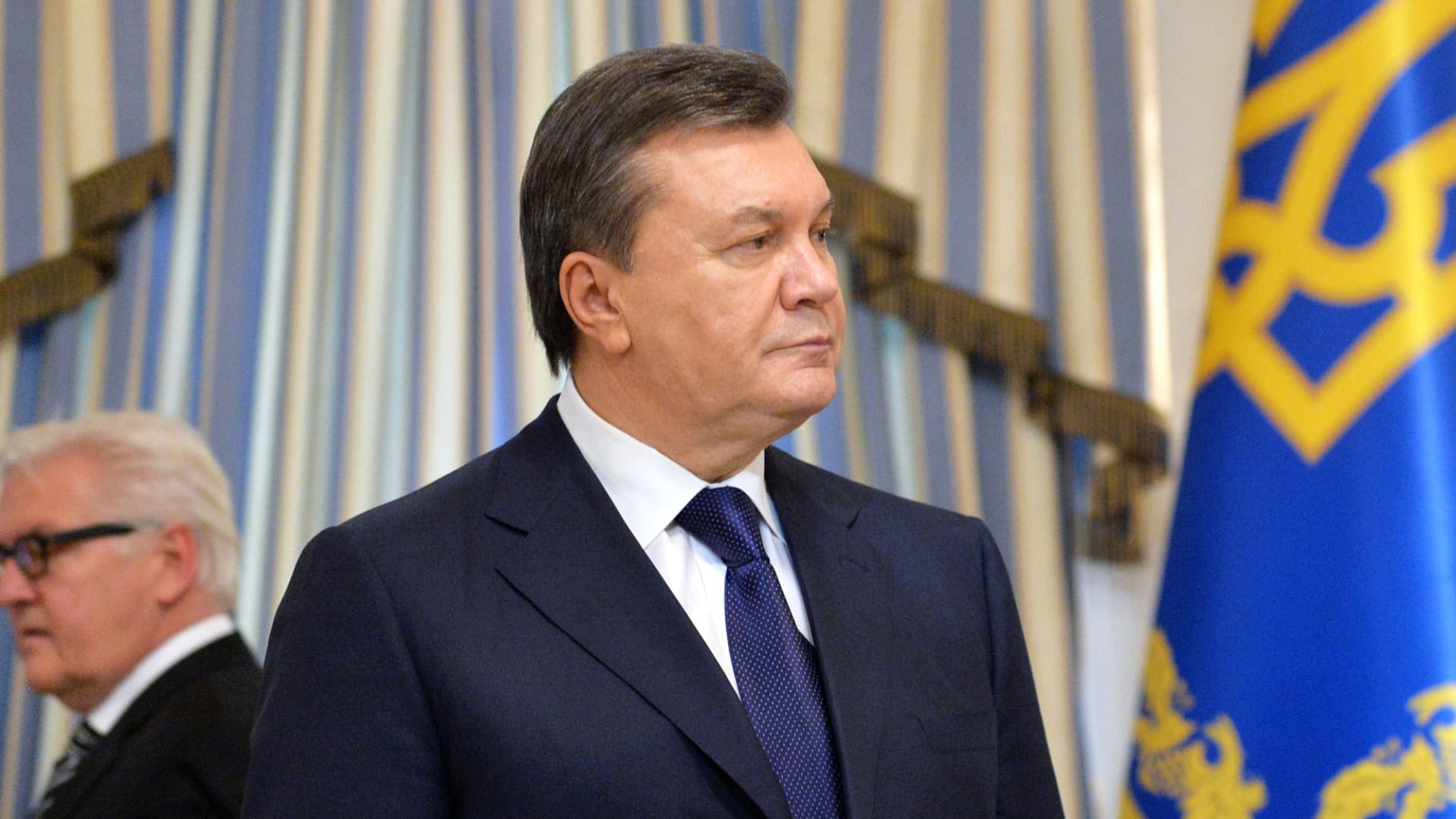 Ukrainian's then-President Viktor Yanukovych looks on before signing an agreement in Kiev on February 21, 2014