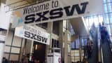 People arrive at the 2014 SXSW conference in Austin, Texas.