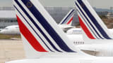Air France planes are parked on the tarmac of Roissy Charles-de-Gaulle airport.