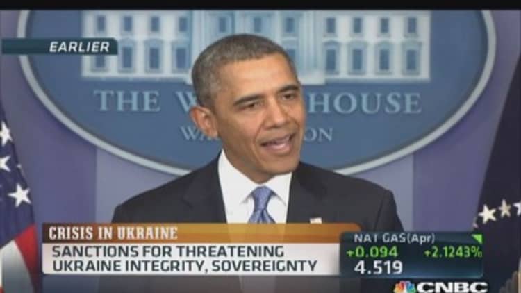 Obama imposes sanctions on 11 Russians