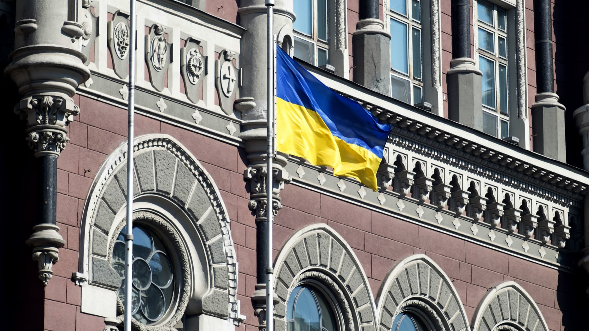 A Ukrainian national flag flies outside the Ukraine central bank in Kyiv.