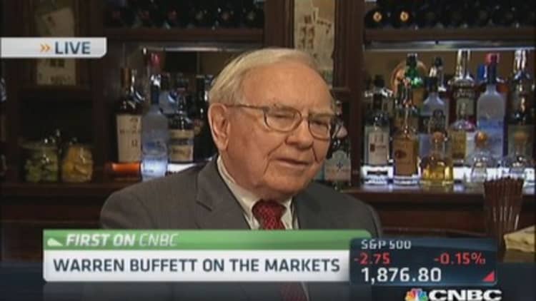 Buffett: Love Coke, like IBM, market not too frothy