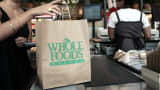 A customer checks out of a Whole Foods Market in Washington, D.C.