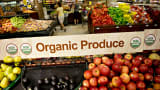 An organic produce sign stands over a display in the produce department of a Kroger supermarket in Peoria, Illinois.