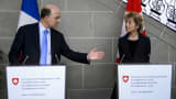 French Economy, Finance and Foreign Trade Minister Pierre Moscovici (L) gestures next to Swiss Finance Minister Eveline Widmer-Schlumpf after discussing everal bilateral issues related to the tax system, cooperation in tax compliance, and cross-border workers on March 6, 2014.