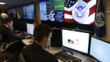 Department of Homeland Security employees work inside the National Cybersecurity and Communications Integration Center in Arlington, Va.
