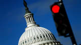 A traffic light is seen in front of the Capitol building in Washington.