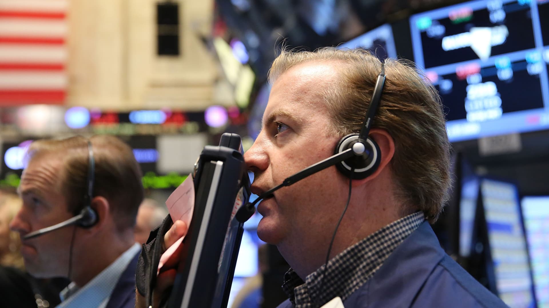 Traders work on the floor of the New York Stock Exchange (NYSE) on Friday.