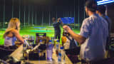 Customers play at the opening of Topgolf’s Scottsdale, Ariz., location.