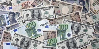 Dollar slides, yuan gains on China PMI; hot inflation lifts euro 