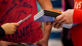 Customers shop for back to school supplies at a Target store.