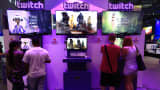 Visitors stream online computer games on the Twitch Interactive stand at Gamescom video games trade fair in Cologne, Germany.