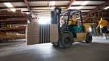 A stack of plywood is moved with a forklift in the warehouse at Maze Lumber in Peru, Illinois.