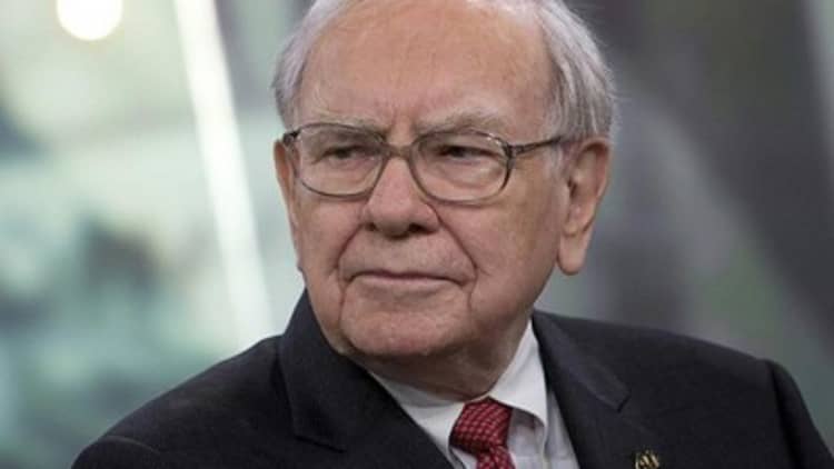 Buffett buying stocks and businesses
