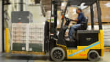 A forklift operator loads a semi-trailer with pallets of seasoning at the Badia Spices factory in Doral, Florida.
