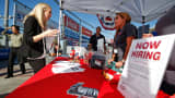 People browse booths at a military veterans' job fair in Carson, Calif., October 3, 2014.
