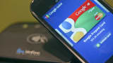 The Google Mobile Wallet app for cardless payments is displayed on a smartphone screen at the Mobile World Congress.