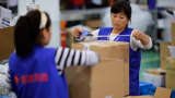 Employees work at an Alibaba Group warehouse, Hangzhou, China.