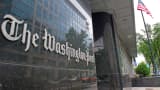 The Washington Post sign is displayed on the newspaper’s building in Washington, Aug. 6, 2013.