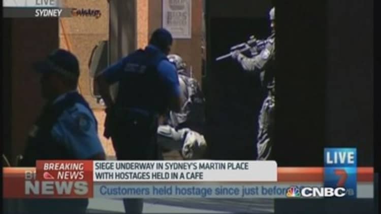 Sydney siege: Hostages taken by gunmen in cafe