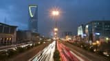 Vehicle light trails pass the Kingdom Tower on King Fahad Road in Riyadh, Saudi Arabia.
