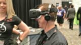 An attendee at the 2015 Adult Entertainment Expo in Las Vegas demos the Oculus virtual reality glasses.