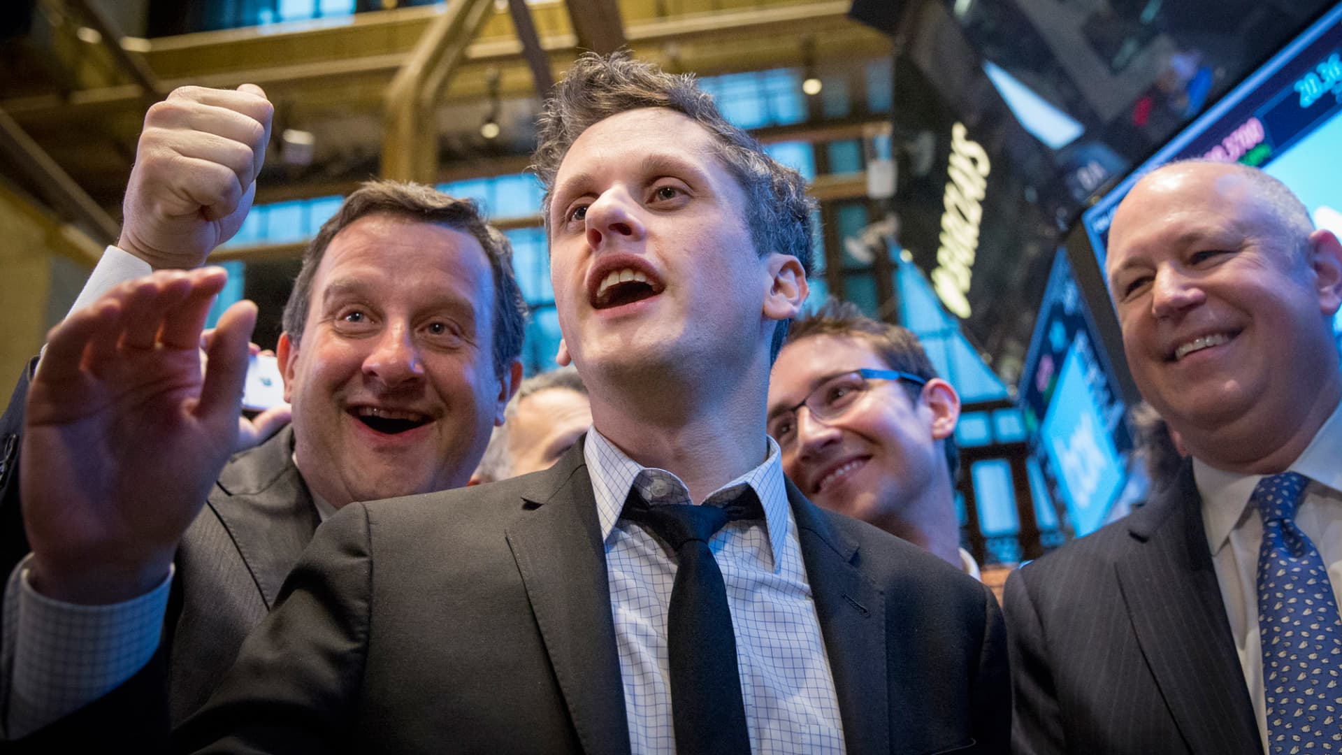 Box co-counders Aaron Levie (C) and Dylan Smith (2nd R) celebrate their company's IPO on the floor of the New York Stock Exchange, Jan. 23, 2015.