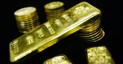 Gold firms as dollar wilts on amended Brexit deal