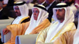 The oil ministers of Qatar, Saudi Arabia and the United Arab Emirates attend the opening session of the Arab Energy Conference in Abu Dhabi.