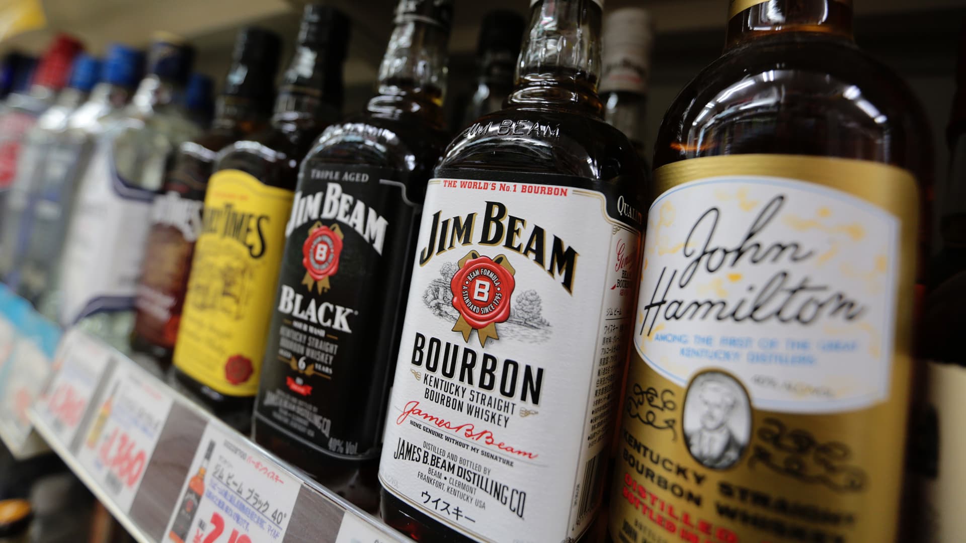 Jim Beam maker says some customers trading down, others still paying more for high-end liquor