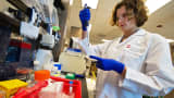 A scientist at Gilead Sciences analyzes patient antibody levels at the Gilead laboratory in Foster City, California.