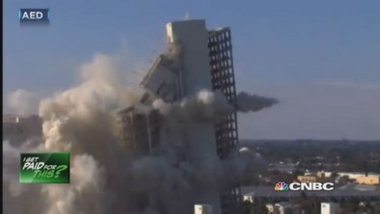 We get paid to implode buildings