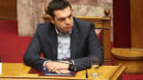 Greek Prime Minister Alexis Tsipras addresses to the parliament members during government's policy statement in Athens, on February 8, 2015.