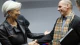 International Monetary Fund (IMF) Managing Director Christine Lagarde (L) listens to Greek Finance Minister Yanis Varoufakis during an extraordinary euro zone finance ministers meeting to discuss Athens' plans to reverse austerity measures agreed as part of its bailout, in Brussels February 11, 2015.